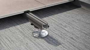 Metal planter aluminium subframe detail showing an adjustable pedestal support beneath terrace paving for a raised roof terrace installation.